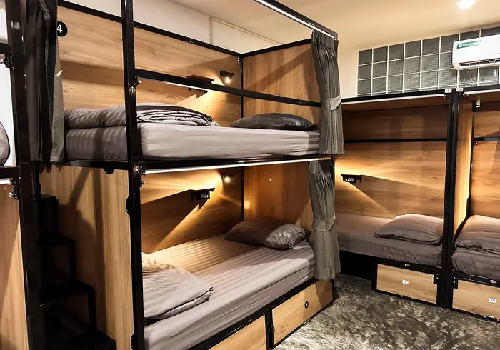 Corner of the bunks with individual reading lights switched on