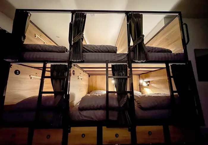 The dorm at night with warm individual reading lights