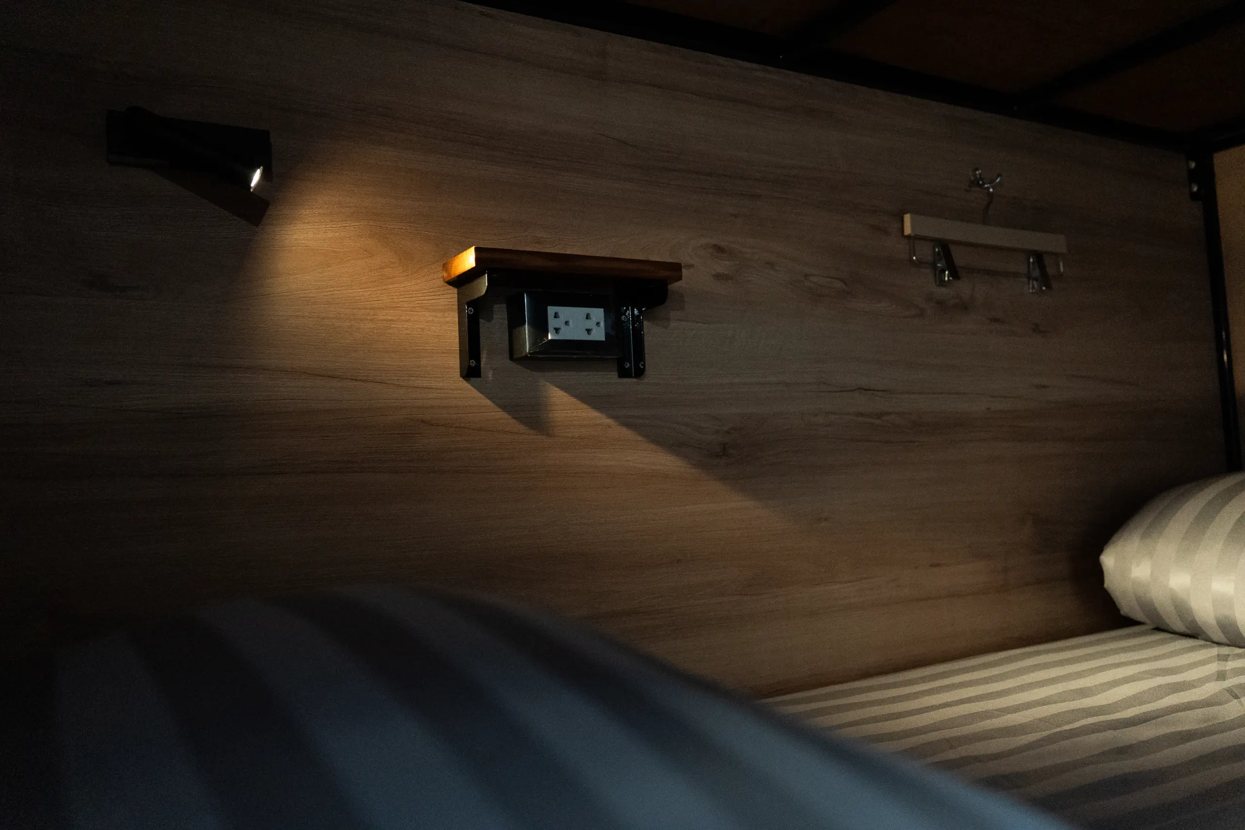 The four bunks at night with warm individual reading lights